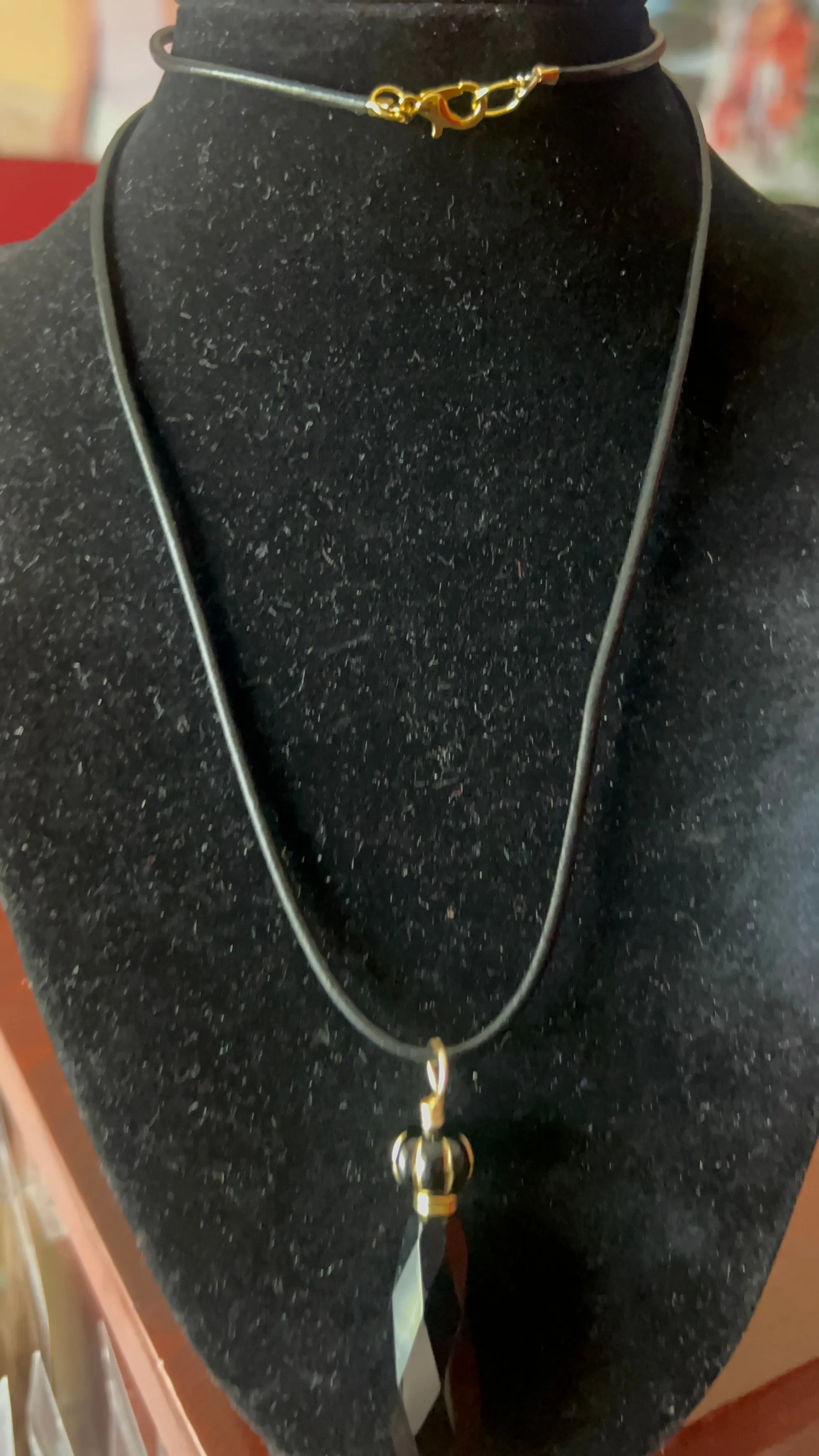 Black Crystal with Gold leaves Pendant on black leather 25 inch necklace  - pendant is 4 inches